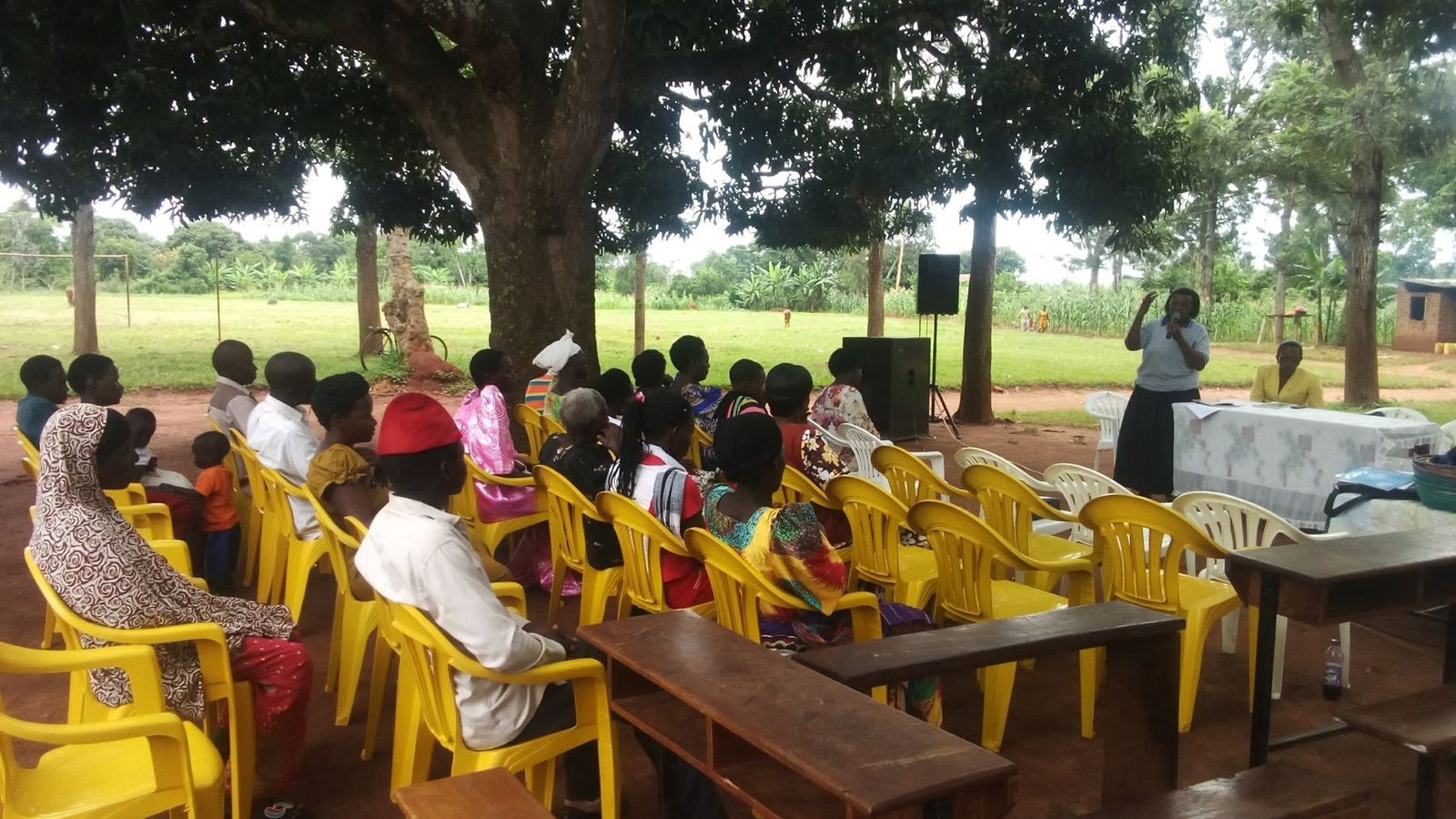 Community members seated in a circle during a group session
